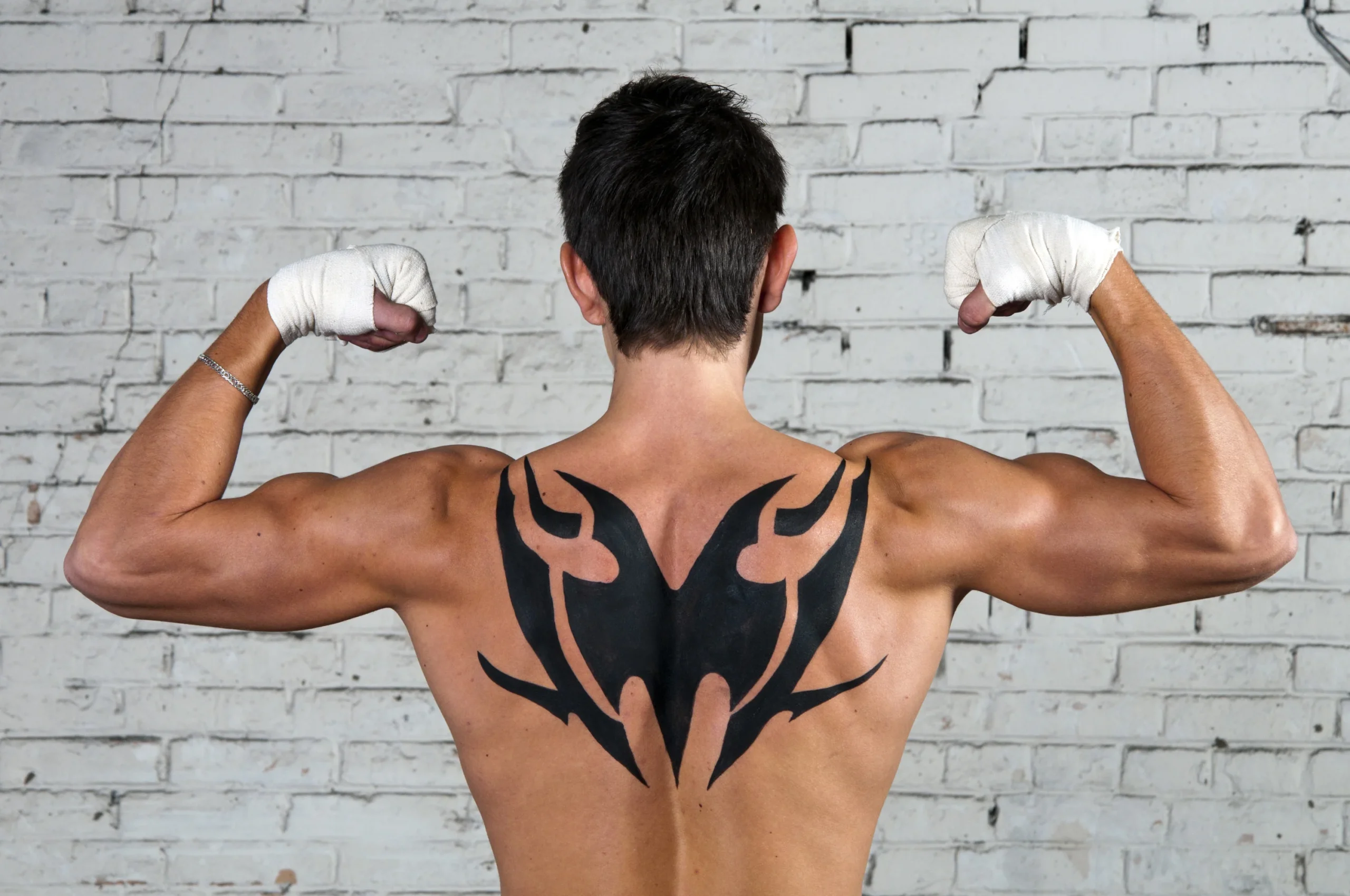 Pain level of spine tattoos compared to others two